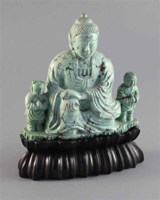 A Chinese turquoise matrix group of a buddha and attendants, circa 1900, 6.75in. 9in. overall